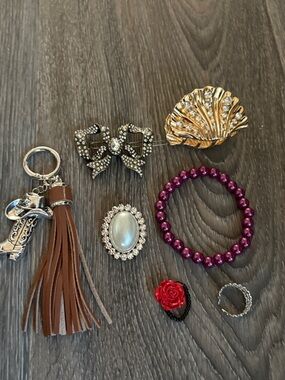 2 rings, silver pin, key chain tassel,  silver barrette and gold hair clip